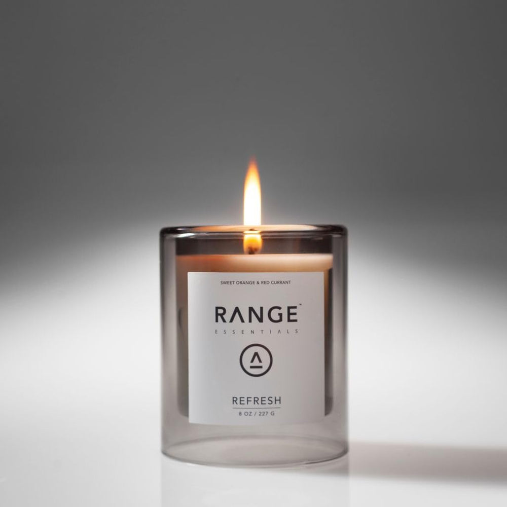 Range Essentials Refresh Candle cotton wick close-up showing steady flame and clean burn.