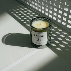 Range Essentials Refresh Candle glass jar image illustrates long-lasting aroma for living spaces.