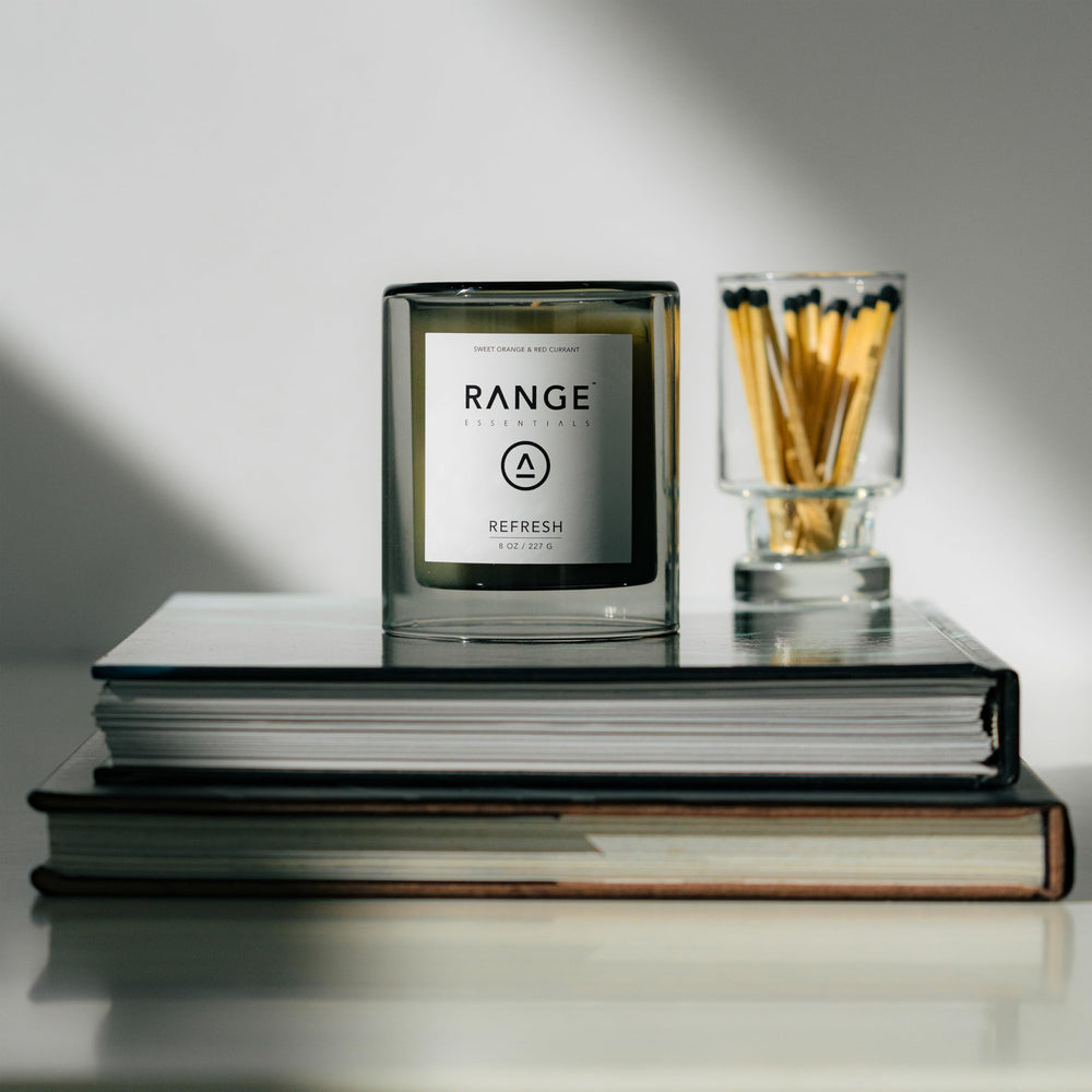 Range Essentials Refresh Candle label close-up highlighting fruit scent and non-toxic, clean-burning design.
