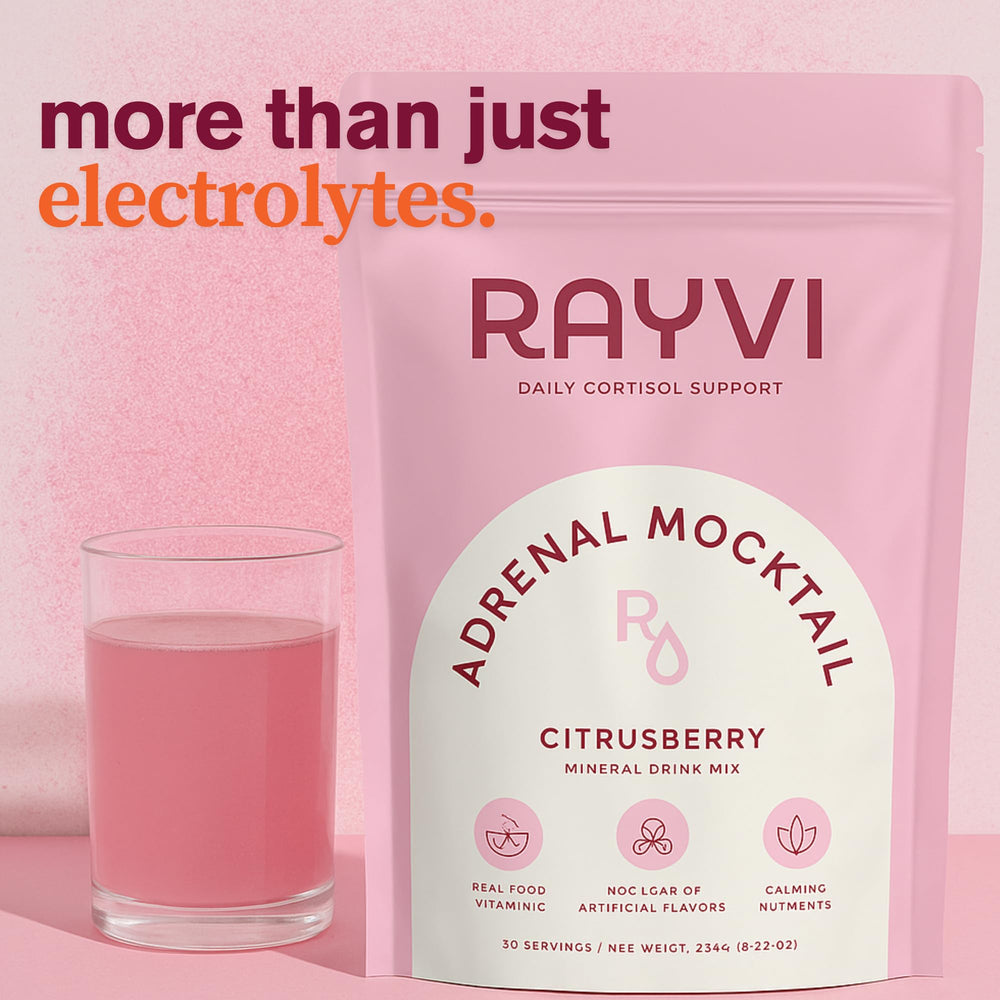 Rayvi Adrenal Electrolytes Powder pour into glass shows caffeine-free refreshment.