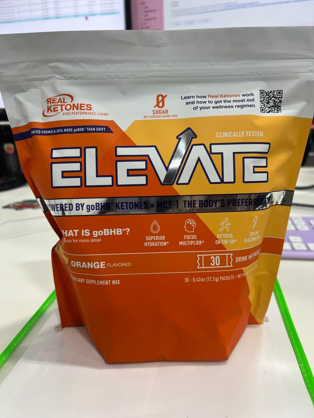 Real Ketones keto hydration glass demonstrating a sugar-free energy boost.