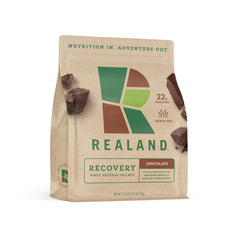 Realand Whey Isolate Chocolate bottle highlighting grass-fed protein for recovery