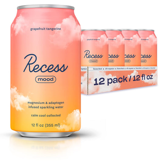 Recess Mood grapefruit-tangerine bottle on a bright desk for evening relaxation.