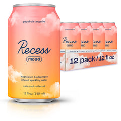 Recess Mood grapefruit-tangerine bottle on a bright desk for evening relaxation.