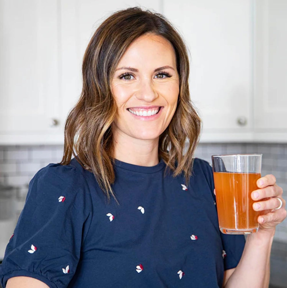 Glass of REDMOND Re-Lyte Immunity ready to drink in a citrus blend