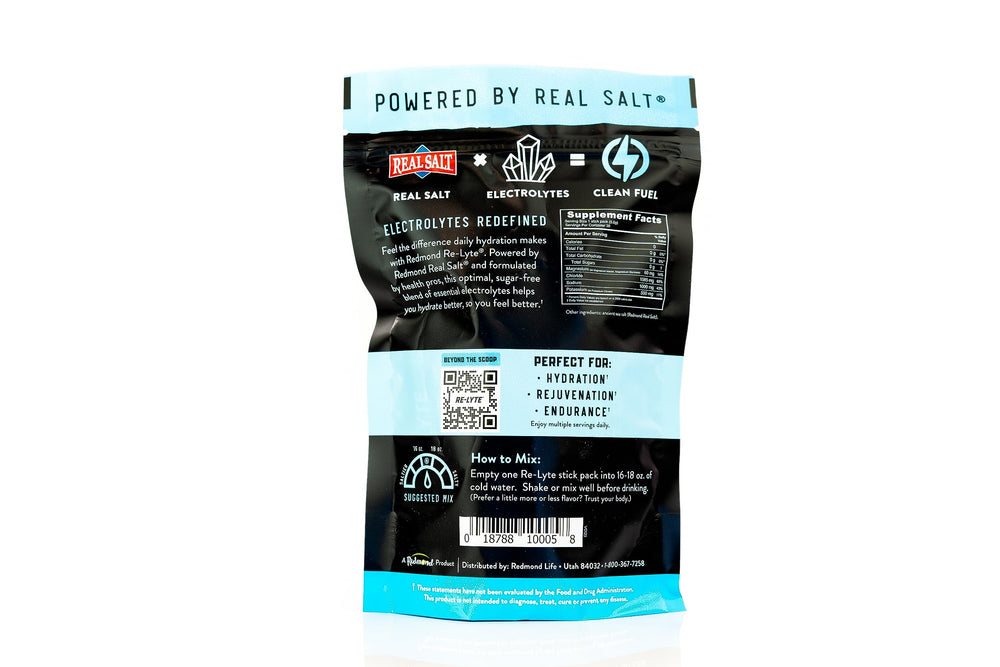 REDMOND Re-Lyte unflavored powder poured into glass to hydrate during workouts.