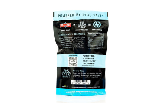 REDMOND Re-Lyte unflavored powder poured into glass to hydrate during workouts.