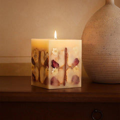 Refillery Haus candle centerpiece enhances cozy living room decor.