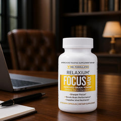 Relaxium FocusMax on a desk next to notebook for study sessions