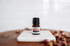 Revive Rose Essential Oil in a glass bottle emphasizing purity.