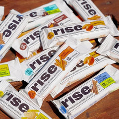 Post-workout Rise bar in hand, ready-to-eat protein snack
