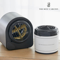 Lifestyle shot shows The Ritz-Carlton scent cartridge enhancing a living room with lush gardenia aroma.
