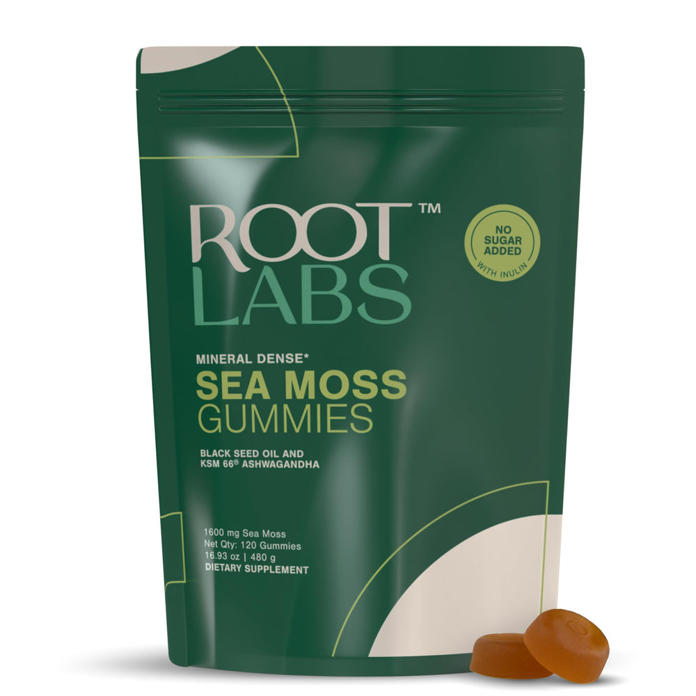 ROOT LABS Sea Moss Gummies bottle on table showcasing vegan, no added sugar formula.