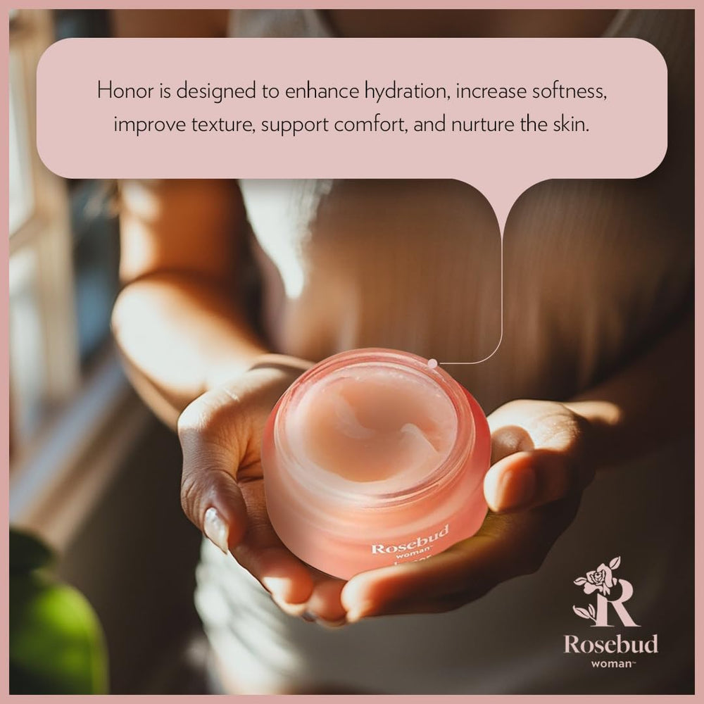 Applying Rosebud Woman Honor balm for intimate hydration.