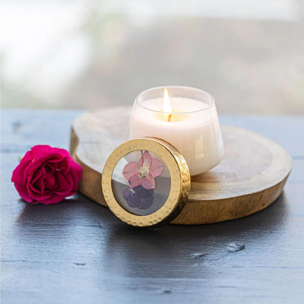 Rosy Rings Blushing Rosewood candle in a jar with pressed florals for elegant ambient lighting