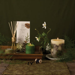 Rosy Rings Forest Round Candle evokes a misty woodland path in your home.