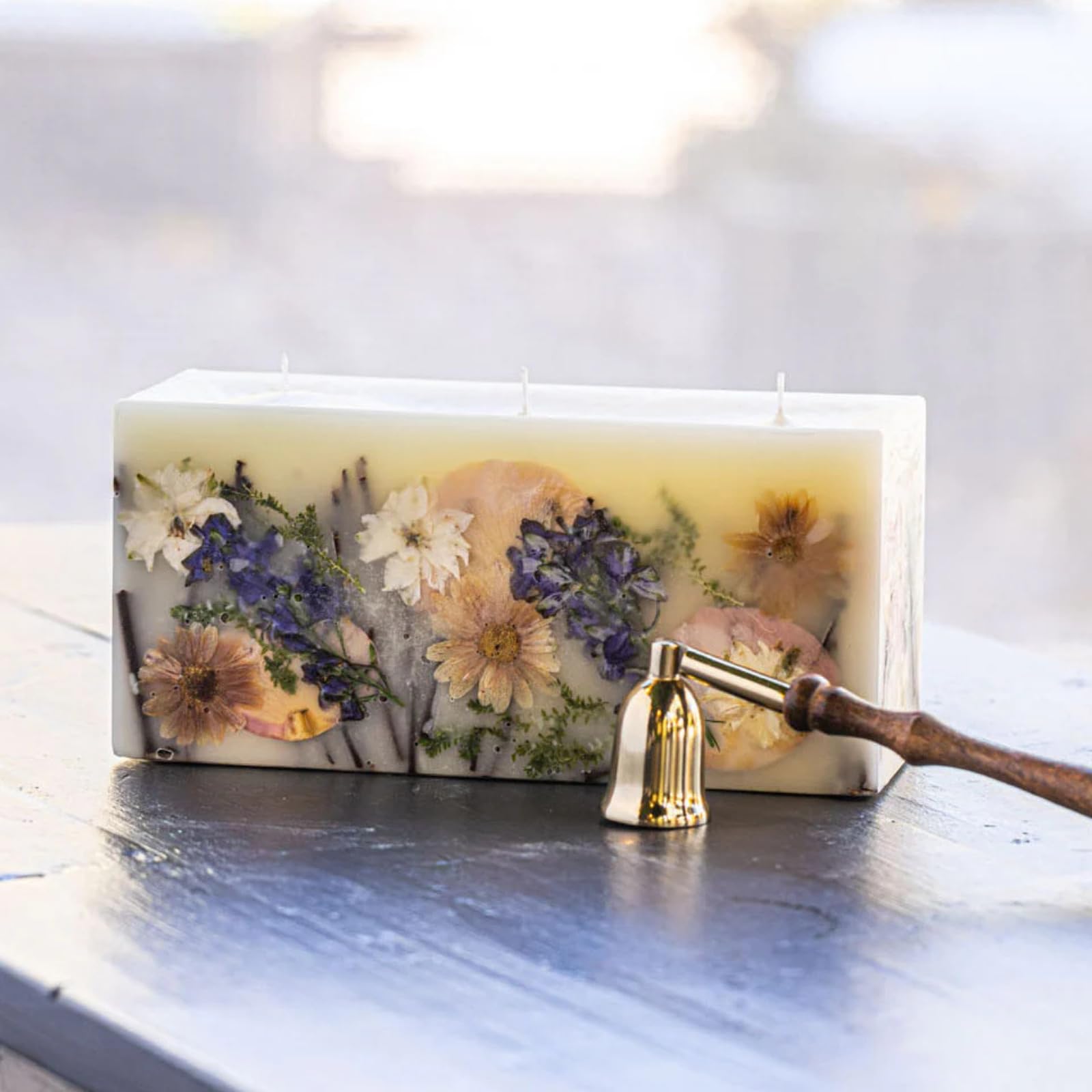 Rosy Rings Vanilla Rain brick candle with botanicals for luxurious home fragrance and ambiance.