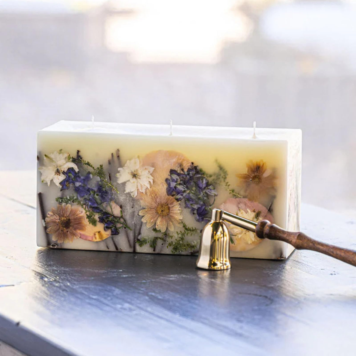 Rosy Rings Vanilla Rain brick candle with botanicals for luxurious home fragrance and ambiance.