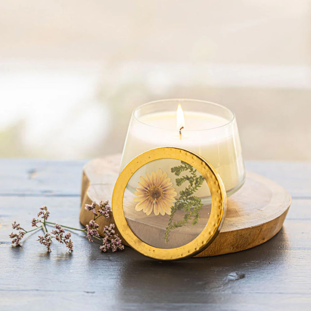 Rosy Rings Vanilla Rain candle jar with pressed florals glows softly for a tranquil room