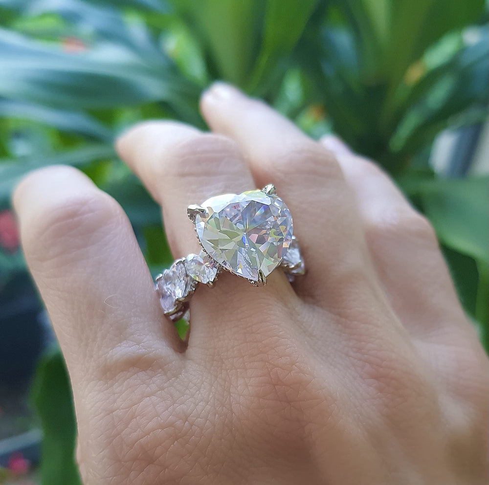 Roxxy Crystals heart ring on display with soft lighting enhances diamond-like glow.