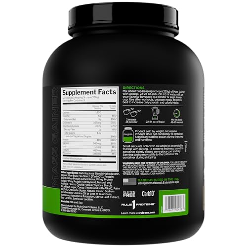 Rule 1 Mass Gainer being poured into a shaker for easy mixing.
