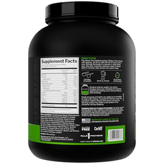 Rule 1 Mass Gainer being poured into a shaker for easy mixing.