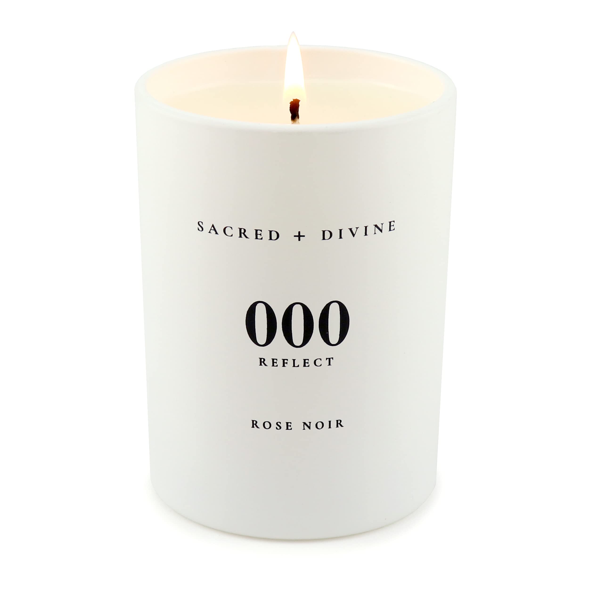 Sacred + Divine 000 minimalist white jar candle in clean decor setting