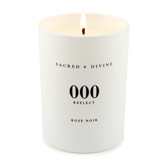 Sacred + Divine 000 minimalist white jar candle in clean decor setting
