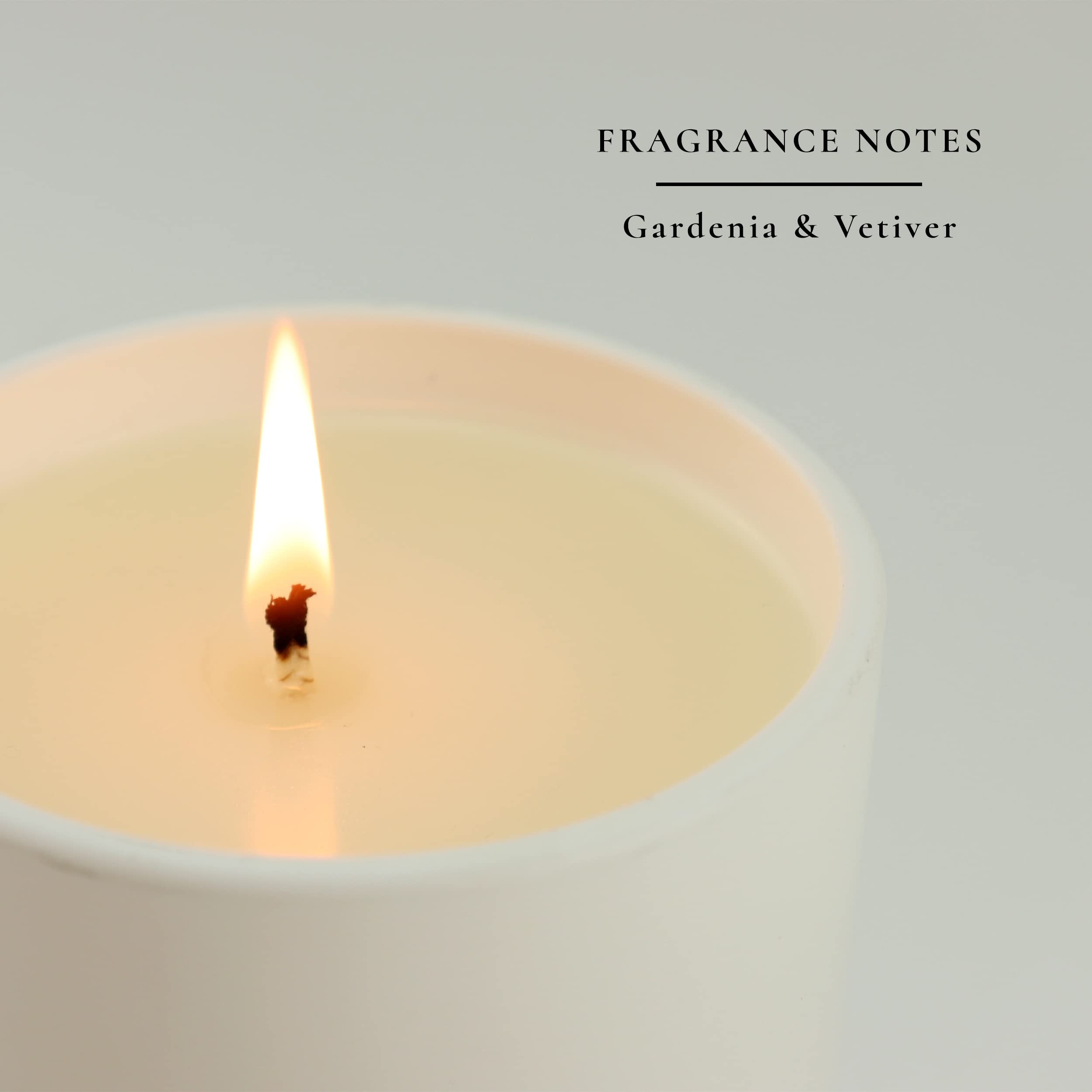 Gardenia and vetiver close-up highlights aromatherapy benefits from Sacred + Divine candle.