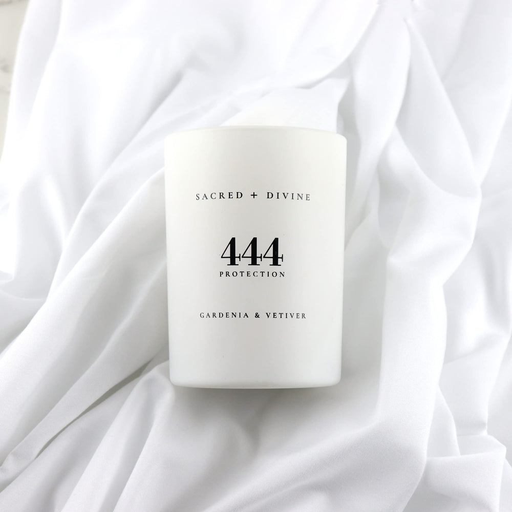 Minimalist white jar with Sacred + Divine 444 logo signaling pure intentions.