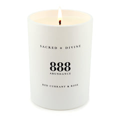 Sacred + Divine 888 candle aroma of red currant and rose to elevate mood during meditation.