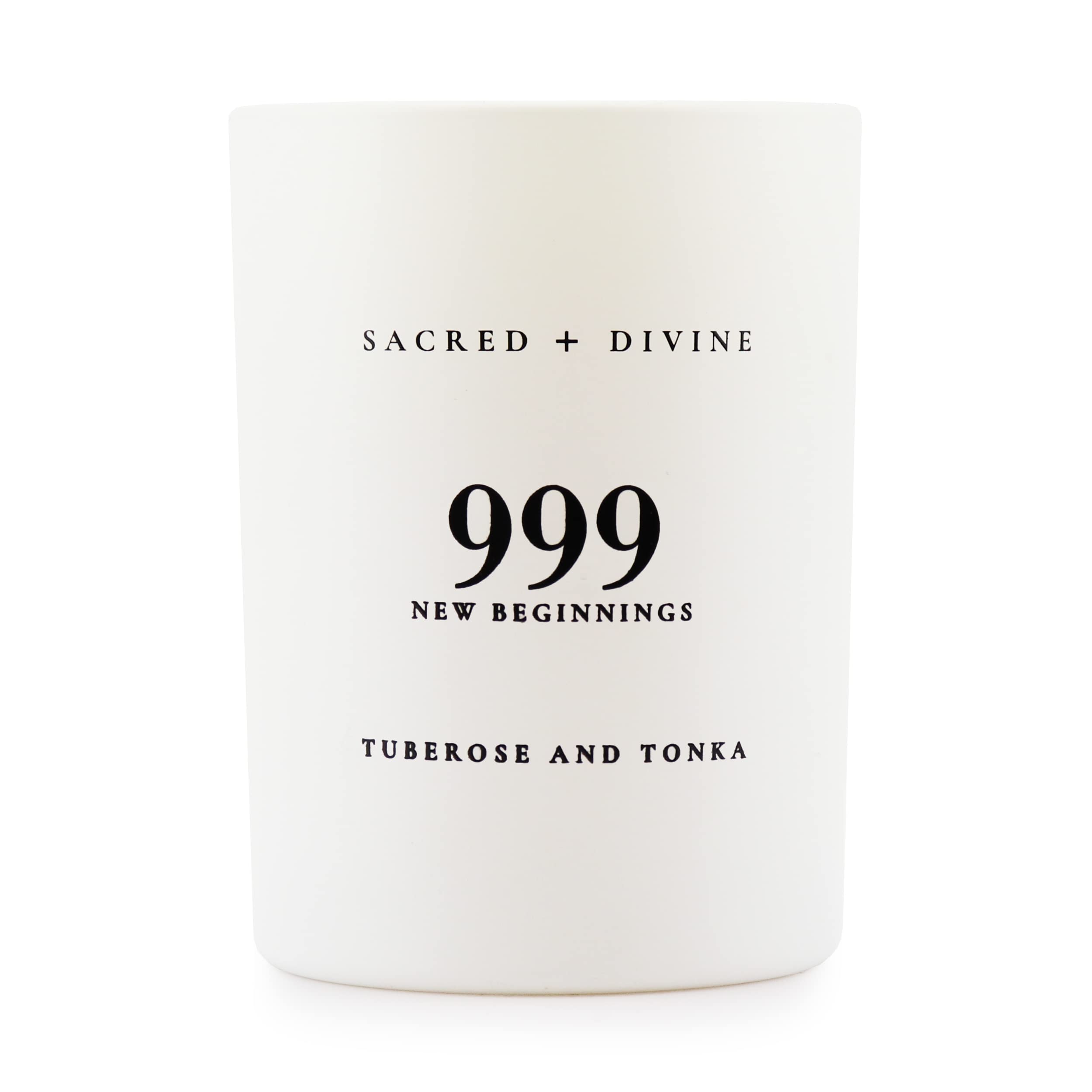 Sacred + Divine 999 candle in a white jar, side view, elevates mindful evenings.