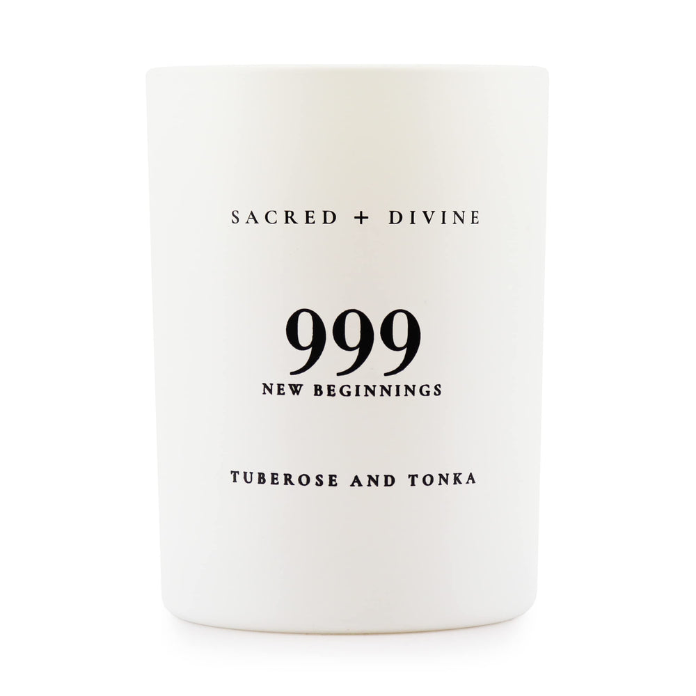 Sacred + Divine 999 candle in a white jar, side view, elevates mindful evenings.