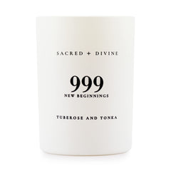 Sacred + Divine 999 candle in a white jar, side view, elevates mindful evenings.