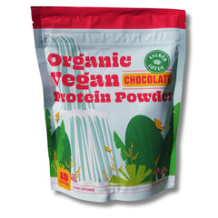 Sacred Lotus vegan protein powder chocolate scoop showing rich texture for a post-workout shake.