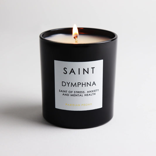 Saint Dymphna candle emits amber glow enhancing relaxation mood