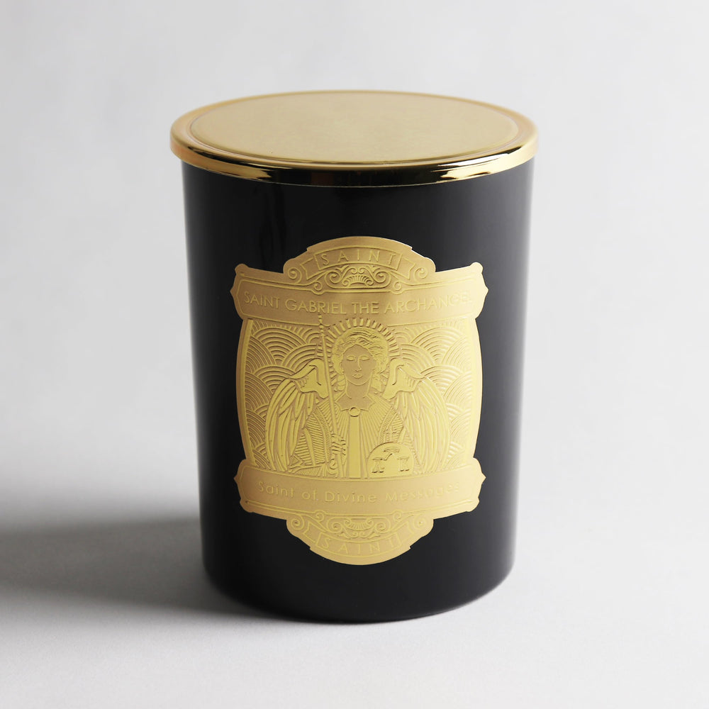 Saint Gabriel prayer coin embedded in wax for personal blessing.