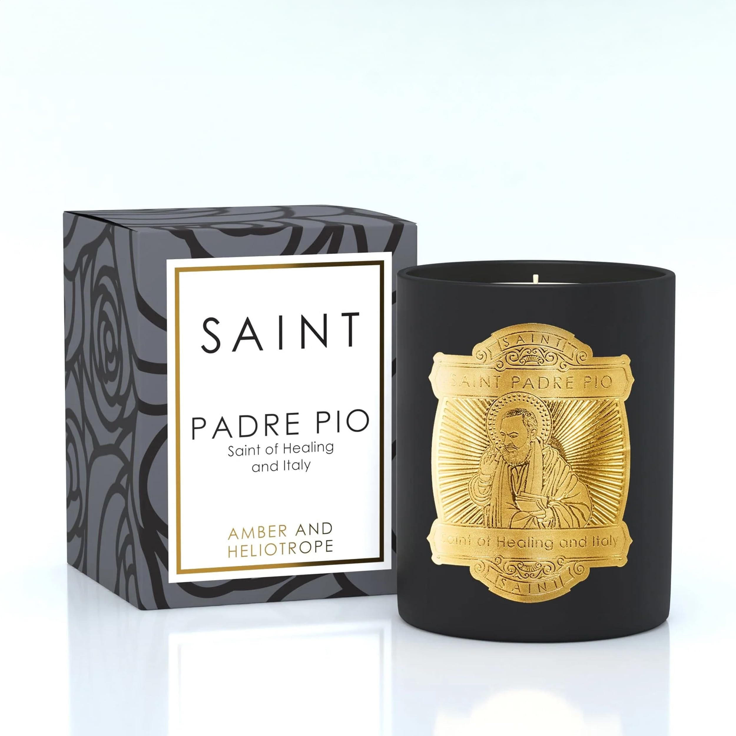 Saint Padre Pio Candle with embedded prayer coin for sacred ambiance.
