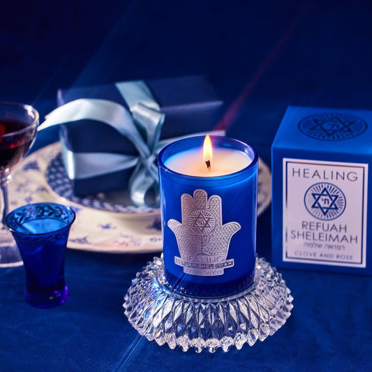 SAINT Refuah Sheleimah candle scent of rose, clove, and vanilla filling the room