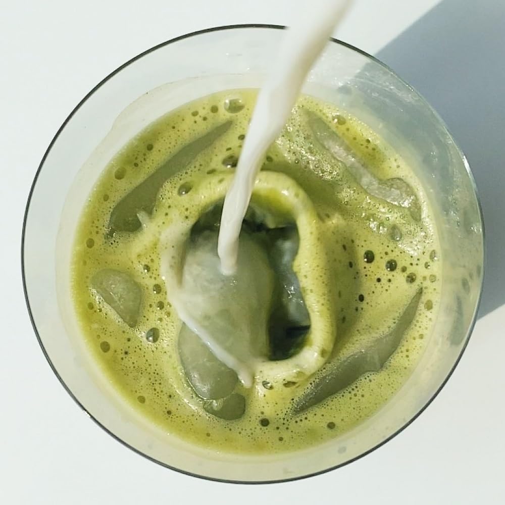 SAKARA shake being poured into a glass after a morning workout.