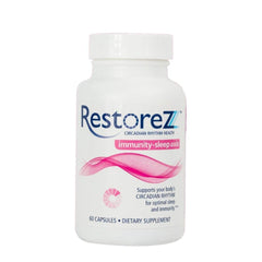 Savant Science RestoreZ Sleep capsules beside the bottle for a calm night routine.