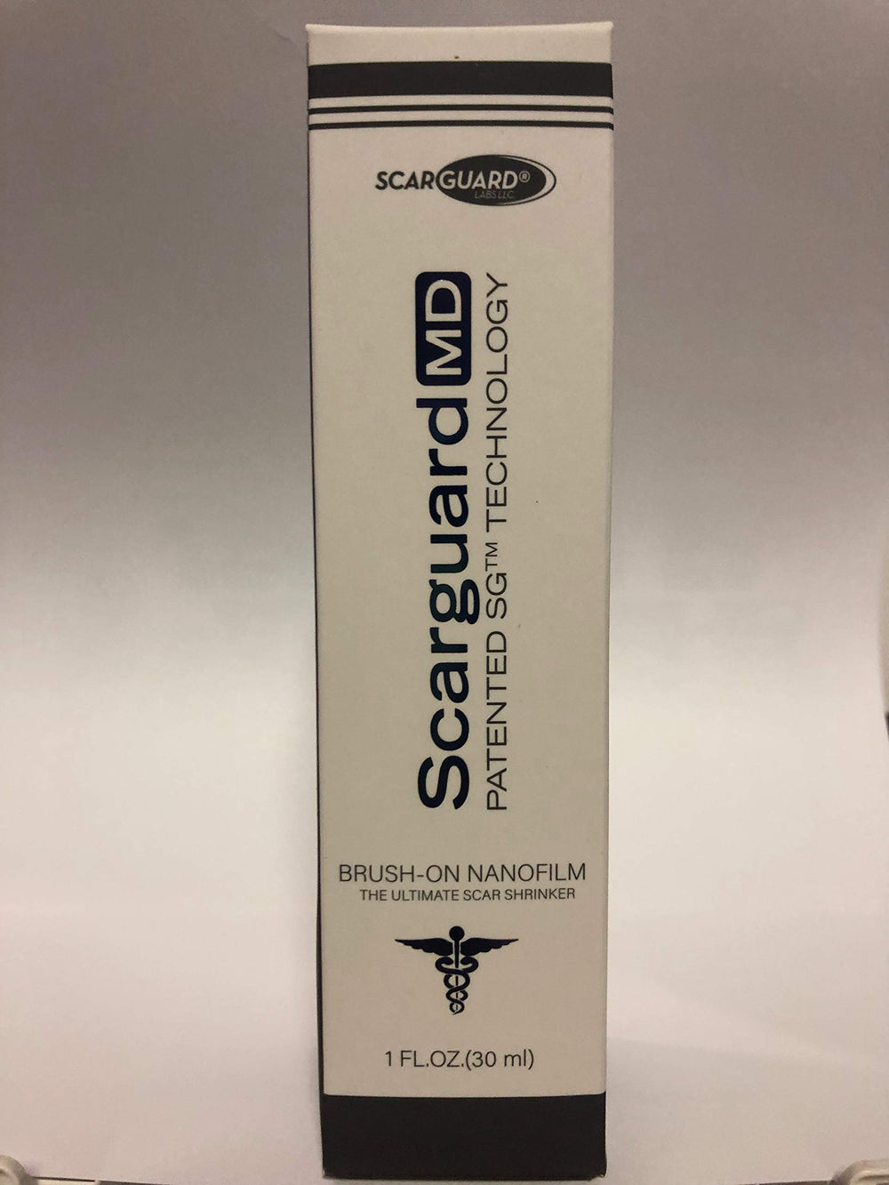 ScarGuard MD bottle pour demonstrates easy brush-on scar improvement