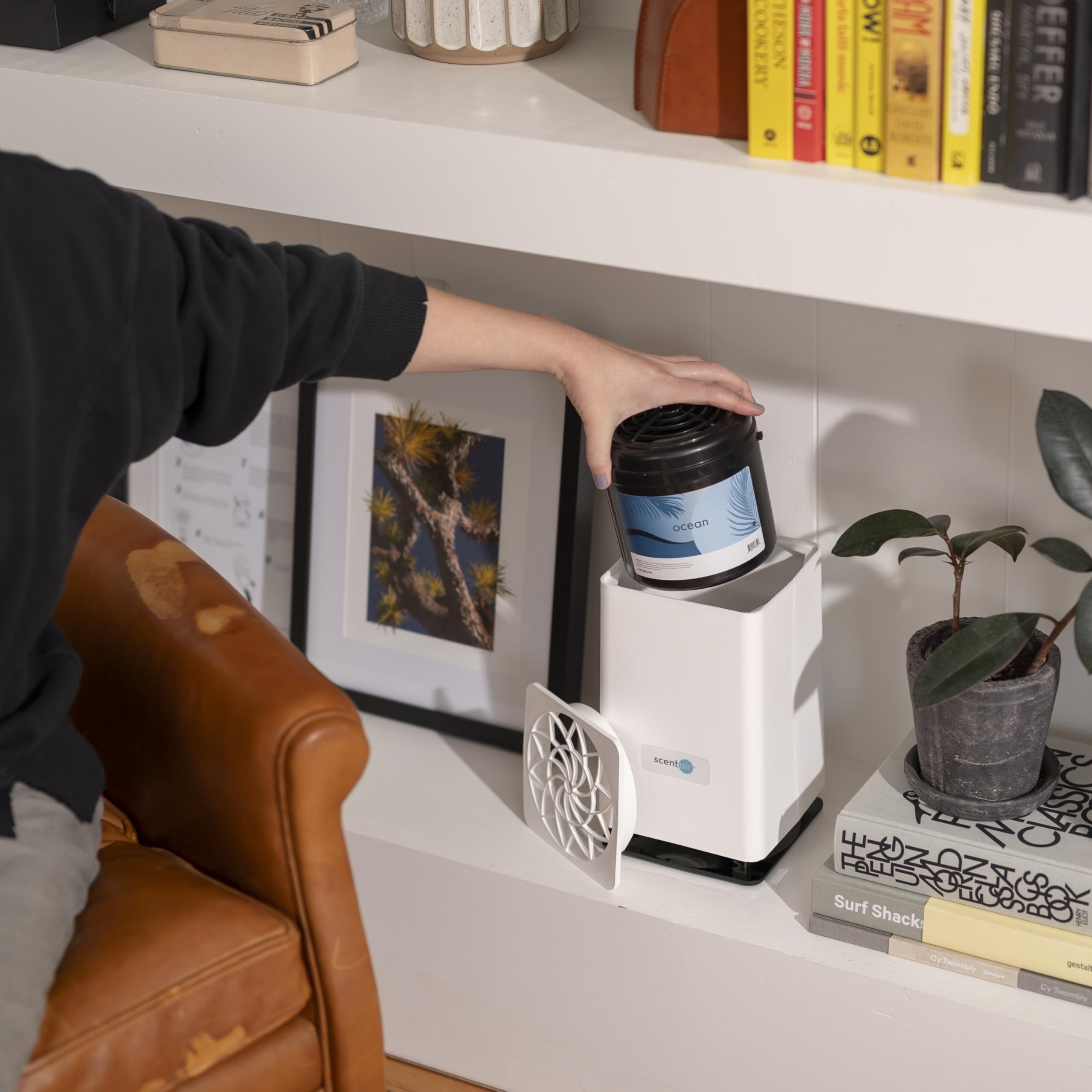 ScentAir Whisper diffuser in a living room creating ambient aroma.