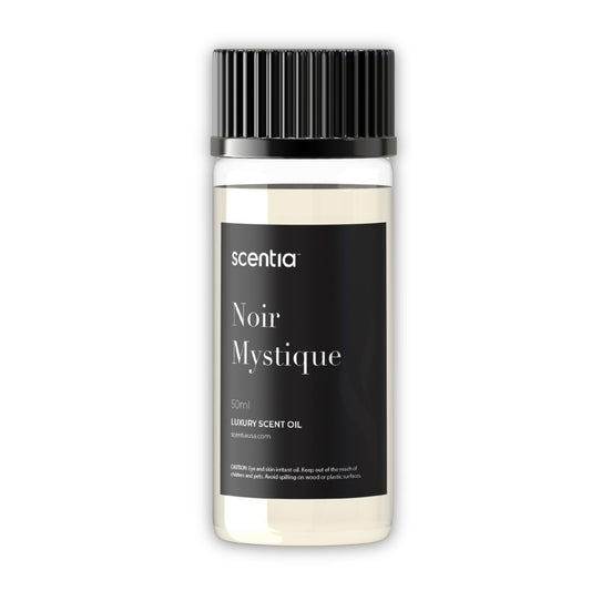 Scentia Noir Mystique bottle pour releases rose-lemon-musk notes for uplifting ambience