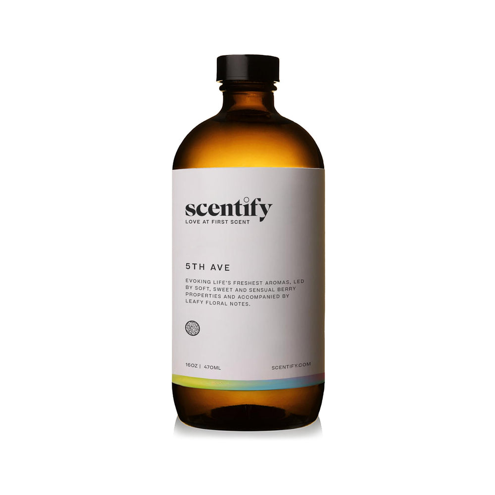 Close-up of Scentify 5th Ave oil bottle highlighting elderberry gardenia blend.