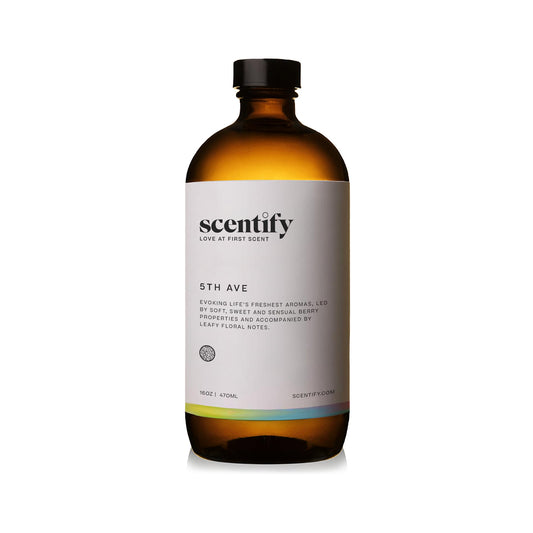 Close-up of Scentify 5th Ave oil bottle highlighting elderberry gardenia blend.