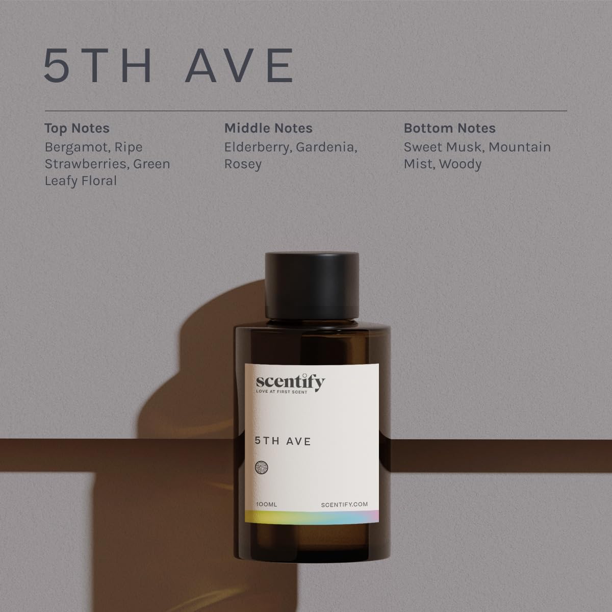 Amber glass bottle of Scentify 5th Ave oil signaling long-lasting fragrance.