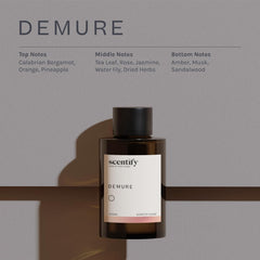 Scentify Demure amber glass bottle highlights premium aroma.
