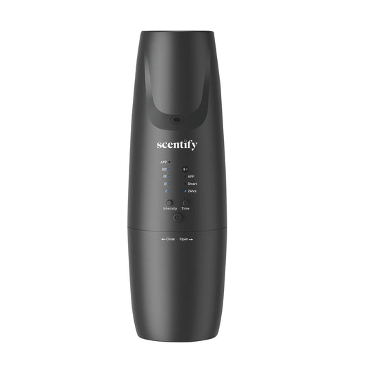 Scentify Plug-in Diffuser V2 plugged into outlet for easy room-wide fragrance.