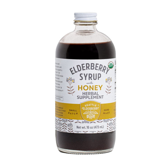 Seattle Elderberry Syrup bottle being poured for a convenient immune-support ritual.